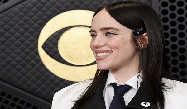 Billie Eilish wears an ICE Out pin as she poses at the red carpet during the 68th Annual Grammy Awards in Los Angeles, California, U.S., February 1, 2026. REUTERS/Mario Anzuoni