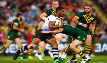 Tui Kamikamica of Fiji is tackled by Michael Morgan of Australia during the Rugby League World Cup men's semi-final match between Australia and Fiji at the Suncorp Stadium in Brisbane on November 24, 2017. (Photo by Patrick HAMILTON / AFP) / --IMAGE RESTRICTED TO EDITORIAL USE - STRICTLY NO COMMERCIAL USE--