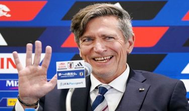 Japan women's national football team head coach Nils Nielsen gestures in response to reporters' applause at the beginning of a press conference following Japan's victory in the AFC Womens Asian Cup Australia 2026 football tournament, in Tokyo on March 23, 2026. (Photo by Kazuhiro NOGI / AFP)