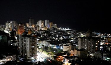 Buildings and street lights illuminate the night as Cubans this week began to reap the benefits of a recent 100,000 metric ton delivery of Russian oil, a temporary lifeline for the energy-starved nation and the first major shipment of oil to the island since the United States moved to cut off its fuel early this year, in Havana, Cuba, April 23, 2026. REUTERS/Norlys Perez     TPX IMAGES OF THE DAY