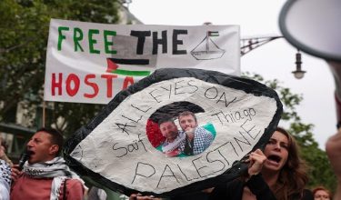 People gather in front of the European Commission office in Barcelona in support of activists Saif Abu Keshek and Thiago Avila, members of the Global Summud Flotilla detained by Israel, in Barcelona, Spain, May 2, 2026. REUTERS/Bruna Casas