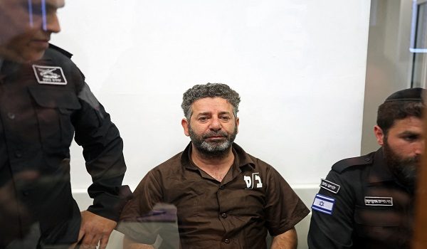 Spanish activist Saif Abu Keshek arrives at a court in Ashkelon on May 3, 2026. Two foreign activists from a Gaza-bound flotilla who were brought to Israel for interrogation appeared before an Israeli court on May 3, a rights group defending them told AFP. The flotilla of more than 50 vessels had set sail from France, Spain and Italy with the aim of breaking an Israeli blockade of Gaza and bringing supplies to the devastated Palestinian territory. (Photo by Ilia YEFIMOVICH / AFP)
