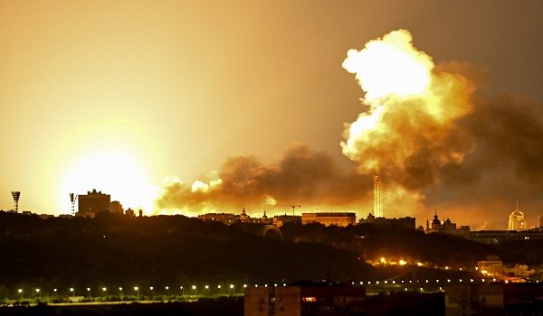 This photograph shows an explosion during drone and missile attacks in Kyiv on June 2, 2026, amid the Russian invasion in Ukraine. Russian missile and drone barrages rocked parts of Ukraine overnight, killing four and wounding dozens, officials said on June 2, the latest attacks in a war with no end in sight. (Photo by Eugene KOTENKO / AFP)