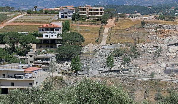 A Lebanese army bulldozer advances along the main road in the southern border village of Debbine on June 4, 2026, as the Israeli military reportedly begins a gradual withdrawal from the village. Israel carried out new strikes in Lebanon and again threatened Beirut, despite the two countries agreeing to a conditional ceasefire that Lebanon's president called the "last chance" for a durable end to the fighting. (Photo by AFP)