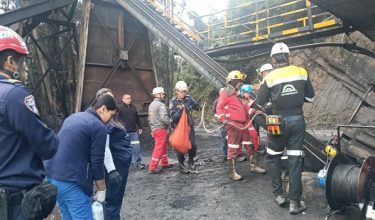 This handout picture released by the Cundinamarca Fire Department shows firefighters inspecting the site of an explosion at a coal mine in Sutatausa, Cundinamarca department, Colombia on May 4, 2026. Twelve people were trapped after a mine explosion "apparently due to a buildup of gases" in central Colombia on May 4, 2026, the regional governor Jorge Emilio Rey said. (Photo by Handout / Cundinamarca Fire Department / AFP) / RESTRICTED TO EDITORIAL USE - MANDATORY CREDIT "AFP PHOTO / CUNDINAMARCA FIRE DEPARTMENT" - HANDOUT - NO MARKETING NO ADVERTISING CAMPAIGNS - DISTRIBUTED AS A SERVICE TO CLIENTS