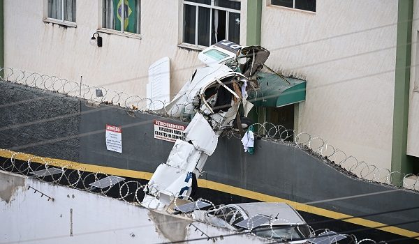 Wreckage of a small plane after crashing into a building is pictured in the downtown of Belo Horizonte, Minas Gerais state, Brazil, on May 4, 2026. (Photo by GLEDSTON TAVARES / AFP)