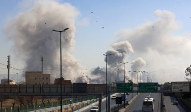 A plume of smoke rises after a strike on the Iranian capital of Tehran on March 5, 2026. Israel pounded Tehran with fresh strikes and Iran targeted Kurdish guerilla groups in Iraq on March 5 as a spiralling war in the Middle East engulfed the entire region. (Photo by ATTA KENARE / AFP)