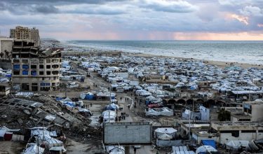 Tents sheltering people displaced by war around the seaport in Gaza City are pictured before sunset on March 26, 2026. (Photo by Omar AL-QATTAA / AFP)