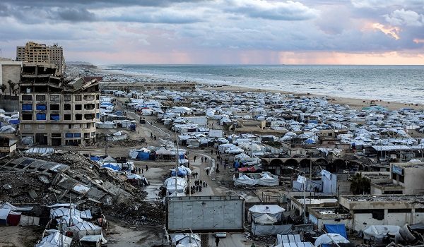Tents sheltering people displaced by war around the seaport in Gaza City are pictured before sunset on March 26, 2026. (Photo by Omar AL-QATTAA / AFP)