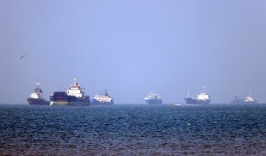 In this picture obtained from Iran's ISNA news agency on May 4, 2026, vessels are pictured anchored in the Strait of Hormuz off Bandar Abbas in southern Iran. Iran's Revolutionary Guards on May 4 denied that any commercial ships had crossed the Strait of Hormuz, after the US military earlier said two US-flagged merchant vessels had transited through the vital waterway. (Photo by Amirhossein KHORGOOEI / ISNA / AFP) /