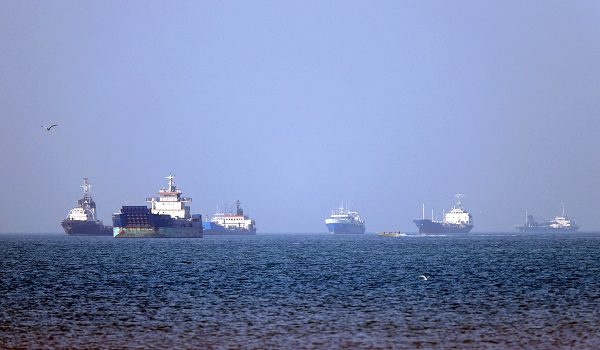 In this picture obtained from Iran's ISNA news agency on May 4, 2026, vessels are pictured anchored in the Strait of Hormuz off Bandar Abbas in southern Iran. Iran's Revolutionary Guards on May 4 denied that any commercial ships had crossed the Strait of Hormuz, after the US military earlier said two US-flagged merchant vessels had transited through the vital waterway. (Photo by Amirhossein KHORGOOEI / ISNA / AFP) /