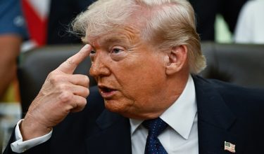 US President Donald Trump gestures as he speaks before signing a proclamation to revive the Presidential Fitness Test Award, a competitive school-based fitness program, in the Oval Office of the White House in Washington, DC on May 5, 2026. (Photo by Kent NISHIMURA / AFP)