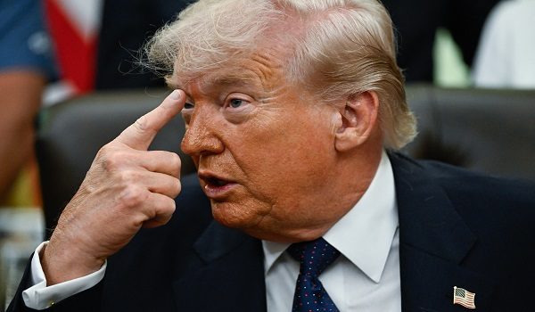 US President Donald Trump gestures as he speaks before signing a proclamation to revive the Presidential Fitness Test Award, a competitive school-based fitness program, in the Oval Office of the White House in Washington, DC on May 5, 2026. (Photo by Kent NISHIMURA / AFP)