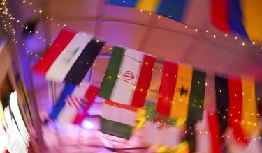 FILE PHOTO: The Iranian flag hangs in a bar downtown as part of decorations for the FIFA World Cup 2026, as the Iranian national soccer team is set to establish its base camp for the event in Tijuana after Mexico’s President Claudia Sheinbaum agreed to host the squad, following reports that the U.S. government did not want Iran to remain at its original base in Arizona during the tournament, in Tijuana, Mexico, June 2, 2026. REUTERS/Victor Medina/File Photo