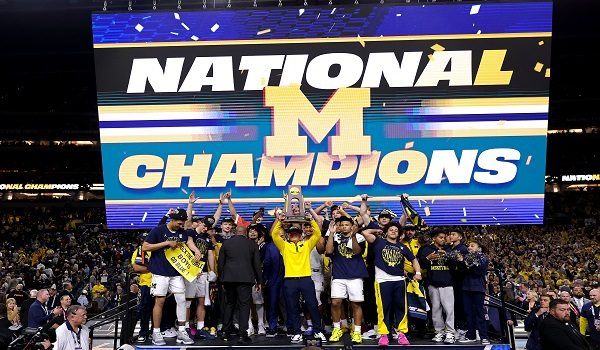 INDIANAPOLIS, INDIANA - APRIL 06: The Michigan Wolverines celebrate after defeating the UConn Huskies 69-63 in the National Championship of the 2026 NCAA Men's Basketball Tournament at Lucas Oil Stadium on April 06, 2026 in Indianapolis, Indiana.   Michael Reaves/Getty Images/AFP (Photo by Michael Reaves / GETTY IMAGES NORTH AMERICA / Getty Images via AFP)