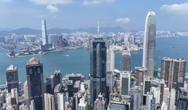 An aerial view shows the skyline of Hong Kong and Kowloon seen from Central district on September 16, 2026. Hong Kong's government unveiled plans to significantly boost investment on innovation and technology as it aims to align the financial hub with mainland China's development goals. (Photo by Peter PARKS / AFP)