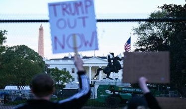 The statue of the 7th US President Andrew Jackson is seen in the background as demonstrators protest against US military action in Iran near the White House in Washington, DC, on April 7, 2026. On April 7, US President Donald Trump warned that "a whole civilization will die" in Iran if the country does not heed his midnight cutoff to open the Strait of Hormuz, as Tehran reported US-Israeli attacks on its infrastructure were already underway. (Photo by Brendan SMIALOWSKI / AFP)