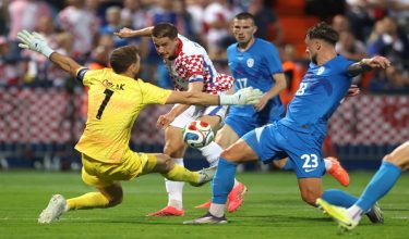 Soccer Football - International Friendly - Croatia v Slovenia - Stadion Varteks, Varazdin, Croatia - June 7, 2026 Croatia's Mario Pasalic in action with Slovenia's Jan Oblak REUTERS/Antonio Bronic