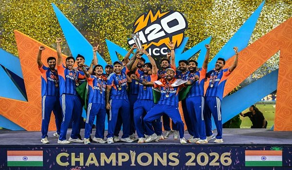 India's players celebrate with the trophy after winning the 2026 ICC Men's T20 Cricket World Cup final match against New Zealand at the Narendra Modi Stadium in Ahmedabad on March 8, 2026. (Photo by Punit PARANJPE / AFP)
