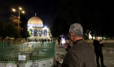 Muslim worshippers use their phones in front of the Dome of the Rock, as they arrive to attend early morning prayers at Al-Aqsa compound, also known to Jews as the Temple Mount, amid a two-week ceasefire in the Iran war, in Jerusalem, April 9, 2026. REUTERS/Sinan Abu Mayzer  REFILE - CLARIFYING CAPTION FROM "FOLLOWING" TO "AMID".