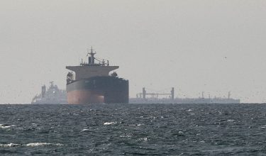 FILE PHOTO: FILE PHOTO: Cargo ships in the Gulf, near the Strait of Hormuz, as seen from northern Ras al-Khaimah, near the border with Oman’s Musandam governance, amid the U.S.-Israeli conflict with Iran, in United Arab Emirates, March 11, 2026. REUTERS/Stringer/File Photo/File Photo
