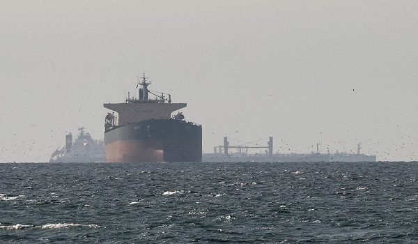 FILE PHOTO: FILE PHOTO: Cargo ships in the Gulf, near the Strait of Hormuz, as seen from northern Ras al-Khaimah, near the border with Oman’s Musandam governance, amid the U.S.-Israeli conflict with Iran, in United Arab Emirates, March 11, 2026. REUTERS/Stringer/File Photo/File Photo