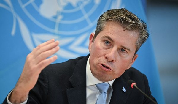 United Nations Under-Secretary-General for Humanitarian Affairs Tom Fletcher speaks during the signing ceremony of a $2 billion pledge of United States for United Nations humanitarian aid in 2026, at the US Mission in Geneva, on December 29, 2025. According to UN data, the United States remains the top humanitarian aid donor in the world, but that amount fell significantly in 2025 to $2.7 billion, down from around $11 billion in 2023 and 2024 and from over $14 billion in 2022. (Photo by Fabrice COFFRINI / AFP)