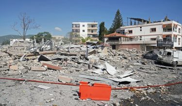 A view of destroyed buildings is pictured at the site of an Israeli airstrike that targeted the southern Lebanese village of Habbouch on May 7, 2026. Israel has repeatedly bombed Lebanon, particularly the south, since a truce came in force since April 17, with Hezbollah retaliating by launching attacks on Israeli troops. Israeli strikes on Lebanon have killed more than 2,700 people and displaced more than a million, particularly from southern and eastern Lebanon and Beirut's southern suburbs, since March 2. (Photo by Abbas FAKIH / AFP)