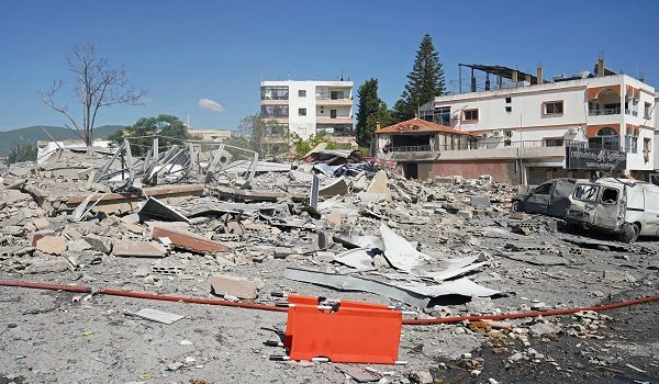 A view of destroyed buildings is pictured at the site of an Israeli airstrike that targeted the southern Lebanese village of Habbouch on May 7, 2026. Israel has repeatedly bombed Lebanon, particularly the south, since a truce came in force since April 17, with Hezbollah retaliating by launching attacks on Israeli troops. Israeli strikes on Lebanon have killed more than 2,700 people and displaced more than a million, particularly from southern and eastern Lebanon and Beirut's southern suburbs, since March 2. (Photo by Abbas FAKIH / AFP)