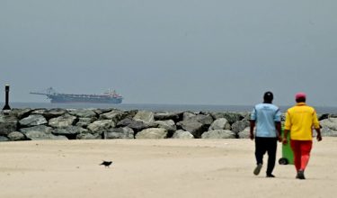 A ship is seen in the Persian Gulf off the coast of Sharjah the day after the failure of US-Iran peace talks on April 13, 2026. The failure of US-Iran peace talks has left the US President with several unpalatable options, as analysts say his order to blockade the strategic Strait of Hormuz could further complicate his next move on April 12, 2026. Any hopes that US Vice President would emerge from the marathon day of negotiations with top Iranian officials with a deal to end a war that has rippled across the Middle East were dashed when he left hosts Pakistan emptyhanded. (Photo by AFP)
