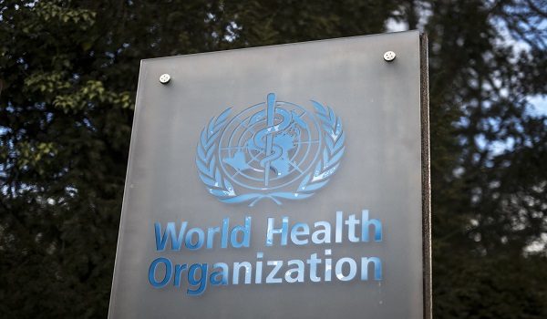 This photograph shows a sign of the World Health Organization (WHO) displayed at their headquarters in Geneva on March 13, 2025. The Swiss government is not doing enough to defend Geneva-based international organisations and NGOs whose operations are threatened by US President Donald Trump's decision to cut foreign aid, Nathalie Fontanet, President of Switzerland's Geneva canton told Le Temps newspaper on March 10, 2025. (Photo by Fabrice COFFRINI / AFP)