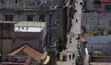View of Havana on June 08, 2026 during a tremor caused by a 6.5-magnitude earthquake. A strong earthquake struck off the coast of western Cuba on June 8, 2026, with AFP journalists in Havana reporting 20 seconds of shaking that forced Cubans out of buildings and into the streets. The US Geological Survey reported that the quake was 6.1 magnitude and struck about 62 miles (100 kilometers) off the island's western tip. (Photo by Pablo PORCIUNCULA / AFP)