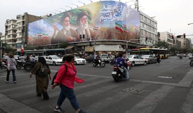 People walk past a billboard depicting the late leader of the Islamic Revolution, Ayatollah Ruhollah Khomeini, and the late Iran's Supreme Leader Ayatollah Ali Khamenei, on a street in Tehran, Iran June 7, 2026.  Majid Asgaripour/WANA (West Asia News Agency) via REUTERS ATTENTION EDITORS - THIS PICTURE WAS PROVIDED BY A THIRD PARTY.    ATTENTION EDITORS - THIS PICTURE WAS PROVIDED BY A THIRD PARTY. ISRAEL OUT. NO COMMERCIAL OR EDITORIAL SALES IN ISRAEL. NO ACCESS FOR ISRAELI MEDIA. NO USE BBC PERSIAN. NO USE VOA PERSIAN. NO USE MANOTO. NO USE IRAN INTERNATIONAL. NO USE RADIO FARDA. DIGITAL: NO USE BBC PERSIAN. NO USE VOA PERSIAN. NO USE MANOTO. NO USE IRAN INTERNATIONAL. NO USE RADIO FARDA.