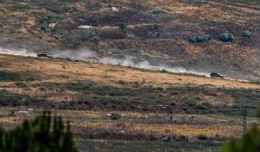 Israeli military vehicles drive on a road in southern Lebanon, as seen from the Israeli side of the Israel-Lebanon border, June 8, 2026. REUTERS/Ayal Margolin    ISRAEL OUT. NO COMMERCIAL OR EDITORIAL SALES IN ISRAEL