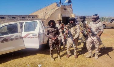 This handout picture released by the Sudanese Rapid Support Forces (RSF) on October 30, 2025, shows RSF members reportedly detaining a fighter known as Abu Lulu (L) in El-Fasher, in war-torn Sudans western Darfur region. In a statement late on October 30, the RSF said it had detained several fighters accused of "violations that occurred during the liberation" of the city, including Lulu who appeared in multiple videos on his TikTok committing summary executions. The RSF, at war with the army since April 2023, seized El-Fasher -- the army's last stronghold in Darfur -- on October 26 after an 18-month siege. (Photo by Rapid Support Forces (RSF) / AFP) / RESTRICTED TO EDITORIAL USE - MANDATORY CREDIT "AFP PHOTO / SUDANESE RAPID SUPPORT FORCES (RSF)" - HANDOUT - NO MARKETING NO ADVERTISING CAMPAIGNS - DISTRIBUTED AS A SERVICE TO CLIENTS