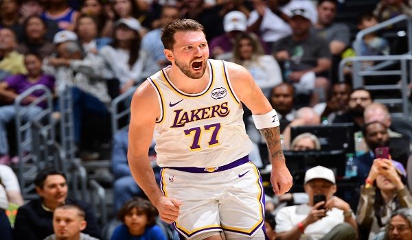 LOS ANGELES, CA - MARCH 8: Luka Doncic #77 of the Los Angeles Lakers celebrates during the game against the New York Knicks on March 8, 2026 at Crypto.Com Arena in Los Angeles, California. NOTE TO USER: User expressly acknowledges and agrees that, by downloading and/or using this Photograph, user is consenting to the terms and conditions of the Getty Images License Agreement. Mandatory Copyright Notice: Copyright 2026 NBAE   Adam Pantozzi/NBAE via Getty Images/AFP (Photo by Adam Pantozzi / NBAE / Getty Images / Getty Images via AFP)
