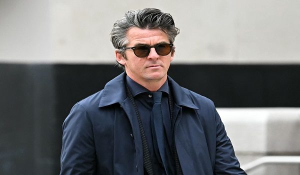 (FILES) Former footballer Joey Barton arrives at Liverpool Crown Court on August 27, 2024, accused of an offence of malicious communications relating to tweets he made in January this year. Former Premier League footballer Joey Barton has been charged with an assault near a golf club in northwest England. At a High Court hearing on March 10, 2026, over a libel claim involving Barton, Gervase de Wilde, representing former England forward Eni Aluko, now a TV pundit, said his instructing solicitor had "received a call from a duty solicitor in a police station in Liverpool" shortly before the hearing. (Photo by Paul ELLIS / AFP)