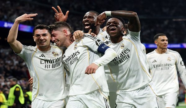 Real Madrid's Uruguayan midfielder #08 Federico Valverde (2L) celebrates his third goal during the UEFA Champions League last 16 first leg football match between Real Madrid CF and Manchester City at Santiago Bernabeu Stadium in Madrid on March 11, 2026. (Photo by Pierre-Philippe MARCOU / AFP)