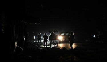People walk along a street during a nationwide blackout in Havana on July 10, 2026. Cuba suffered its second nationwide blackout in five days on July 10 as twin energy and economic crises, compounded by a six-month US fuel blockade, caused the electricity grid to collapse. (Photo by YAMIL LAGE / AFP)
