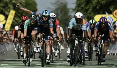 Soudal Quick-Step team's Belgian rider Tim Merlier sprints to the finish line to win the 8th stage ahead of NSN Cycling Team's Eritrean rider Biniam Girmay (2nd R) and Decathlon CMA CGM Team's Dutch rider Olav Kooij (L) during the 113th edition of the Tour de France cycling race, 182 km between Périgueux and Bergerac in southwestern France, on July 11, 2026. (Photo by Loic VENANCE / AFP)