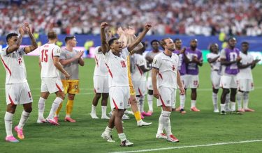 England's midfielder #10 Jude Bellingham celebrates next to forward #09 Harry Kane after winning the 2026 World Cup football tournament quarter-final match between Norway and England at Miami Stadium in Miami Gardens on July 11, 2026.  (Photo by PATRICIA DE MELO MOREIRA / AFP)