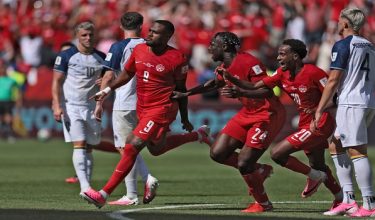 Canada's forward #09 Cyle Larin (C;L) celebrates after scoring a goal during the 2026 World Cup Group B football match between Canada and Bosnia and Herzegovina at the Toronto Stadium in Toronto on June 12, 2026. (Photo by Cole Burston / AFP)