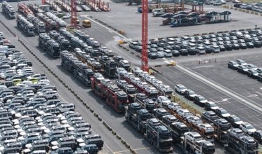 Chinese-made EV cars awaiting export are seen parked at Shanghai port on June 9, 2026. (Photo by CN-STR / AFP) / China OUT