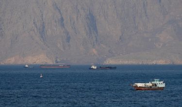 FILE PHOTO: FILE PHOTO: Ships and tankers in the Strait of Hormuz off the coast of Musandam, Oman, April 18, 2026. REUTERS/Stringer/File Photo/File Photo