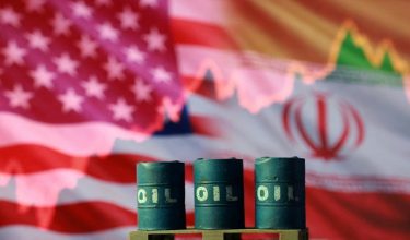 FILE PHOTO: U.S. and Iranian flags, 3D printed oil barrels and rising stock graph are seen in this illustration taken March 23, 2026. REUTERS/Dado Ruvic/Illustration/File Photo