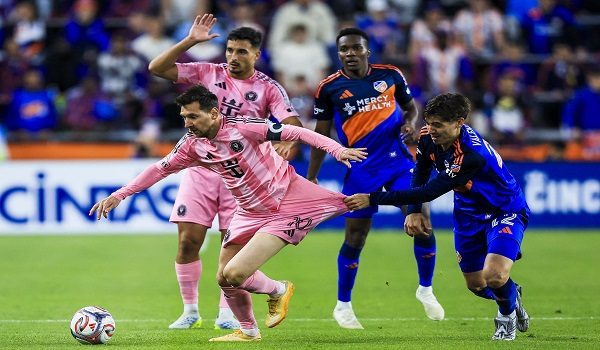 May 13, 2026; Cincinnati, Ohio, USA; Inter Miami CF midfielder Lionel Messi (10) dribbles against FC Cincinnati forward Gerardo Valenzuela (22) in the second half at TQL Stadium. Mandatory Credit: Katie Stratman-Imagn Images