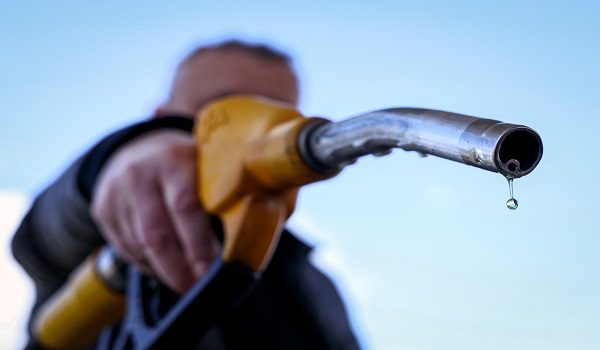 A drop of petrol falls from the nozzle of a petrol pump at a petrol station in Vélizy-Villacoublay, near Paris, on March 9, 2026, as Oil prices soared peaking just short of $120 a barrel as the US-Israeli war against Iran continued into a second week, with Tehran launching fresh retaliatory strikes in the Gulf. (Photo by Alain JOCARD / AFP)