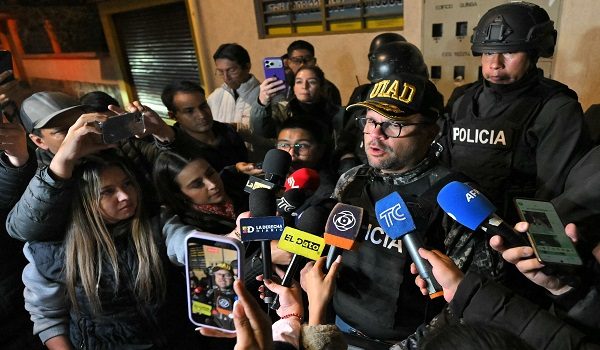 Ecuador's Interior Minister John Reimberg speaks to journalists after the arrest of Eduardo Gomez, alias "Gordo Paul", in a police operation carried out during a curfew imposed by President Daniel Noboa to tackle organized crime, in Quito in the early hours of May 14, 2026. Ecuador's police on May 14 captured a "dangerous" leader of Los Lobos, the country's largest drug trafficking group, in a cinematic operation led by Interior Minister Jhon Reimberg, AFP reporters witnessed. (Photo by AFP)