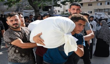 Mourners carry the body of a Palestinian killed in an Israeli strike, according to medics, at Al-Shifa Hospital in Gaza City, June 14, 2026. REUTERS/Dawoud Abu Alkas