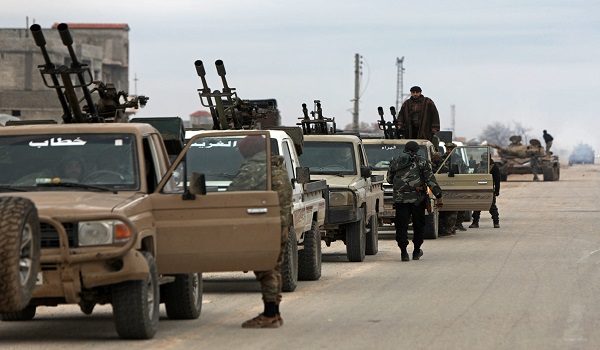 Syrian army soldiers along with their armoured vehicles gather as they prepare to enter the town of Deir Hafer on January 17, 2026. Syria's army said it took control of the town of Deir Hafer outside Aleppo city on January 17, a day after Kurdish forces agreed to withdraw from the area following recent clashes. In a statement to state television, the army said it had established "full military control" of Deir Hafer, while an AFP correspondent on the ground saw troops deploying inside the town. (Photo by Bakr ALkasem / AFP)